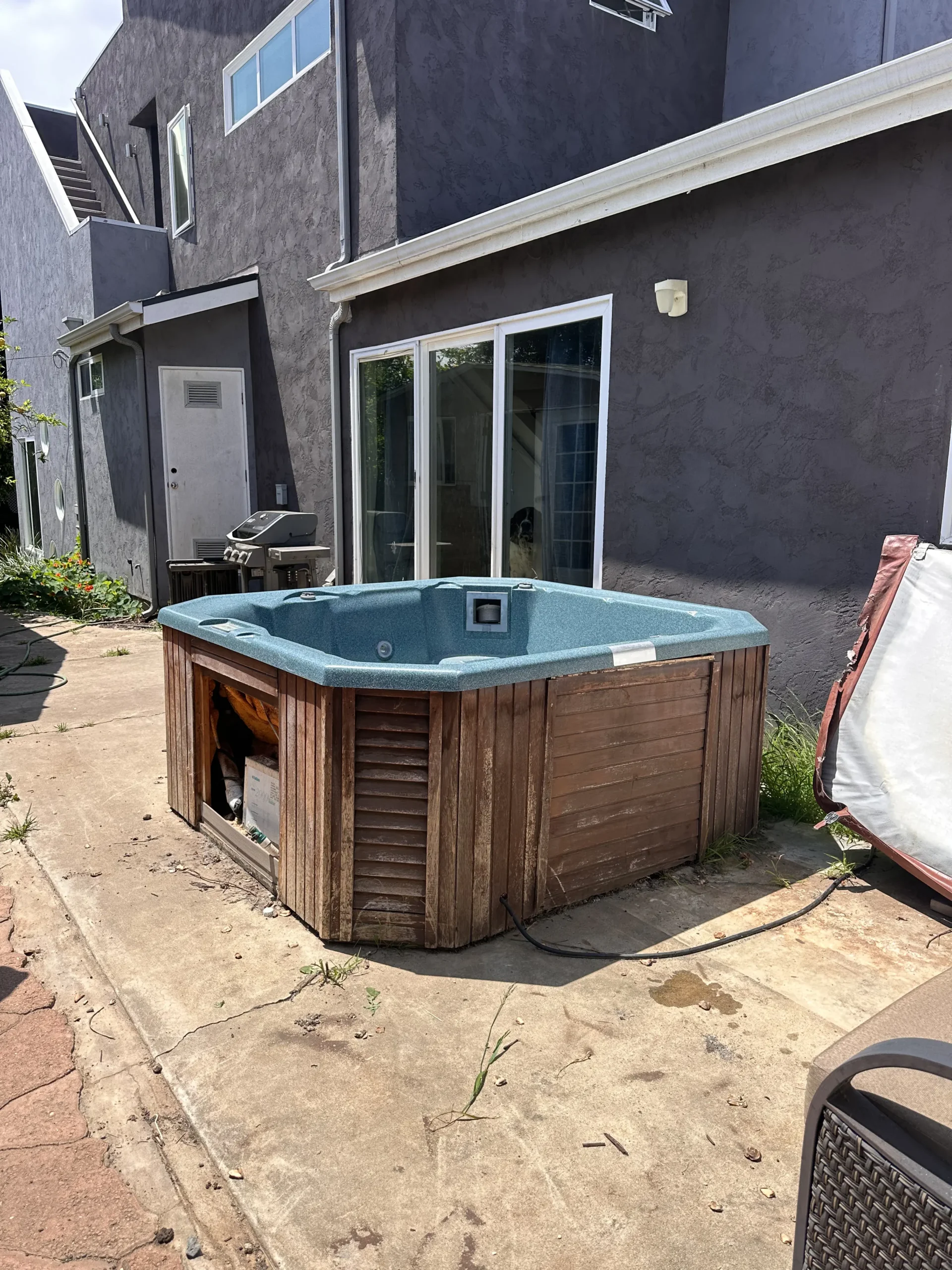 Hot tub in backyard patio area
